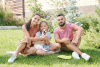 Family with dog in their front yard