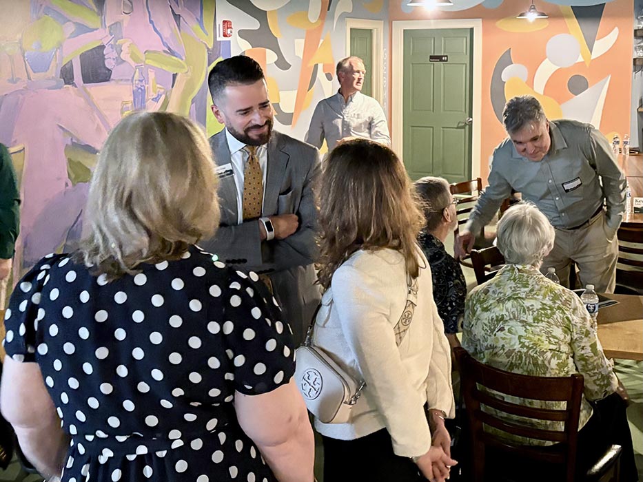 President/CEO Chris Gomez speaks with members at the FHCU Annual Meeting